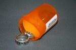 Wedding rings and medication bottle